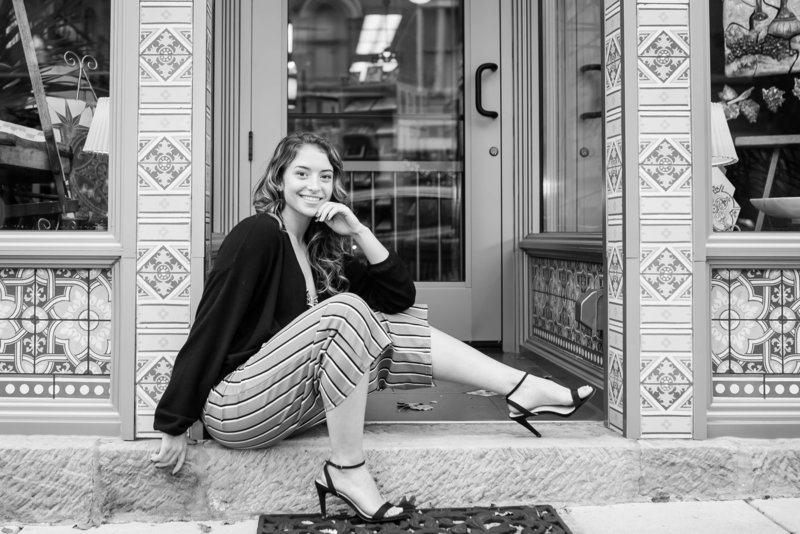 triway high school senior girl standing in door way of art find tile in downtown wooster ohio, black and white  photo, photographed by Jamie Lynette Photography Canton Senior Photographer