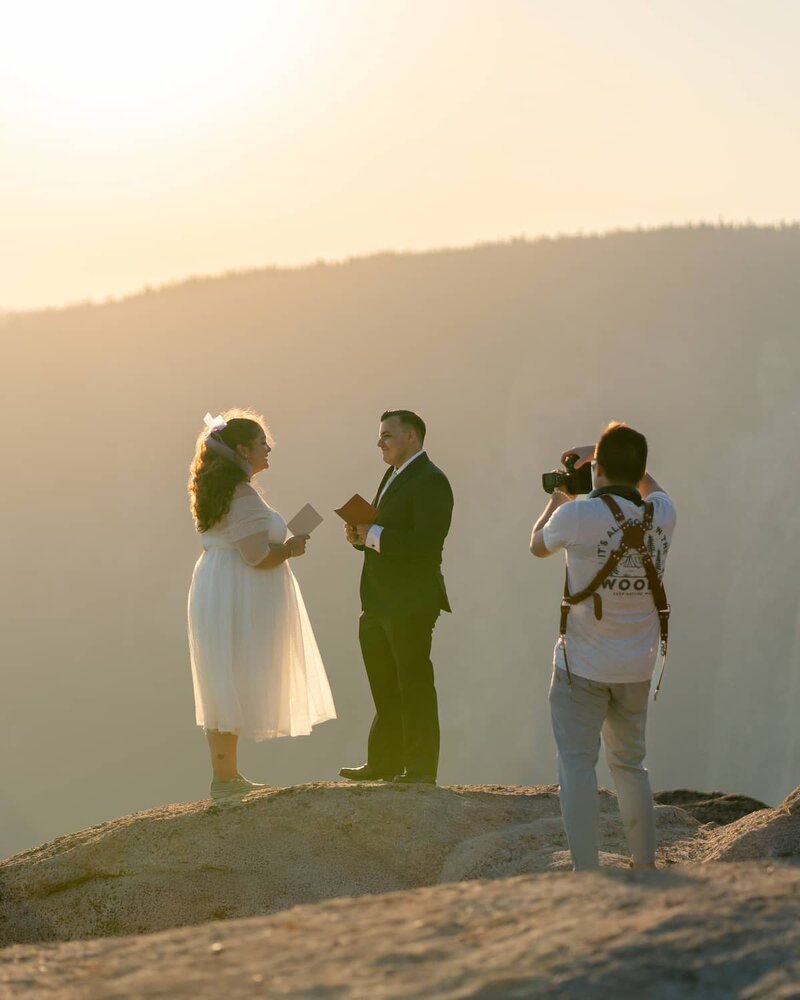 Photographer captures Morgan and Jesse’s emotional vow exchange during golden hour elopement at Taft Point, Yosemite