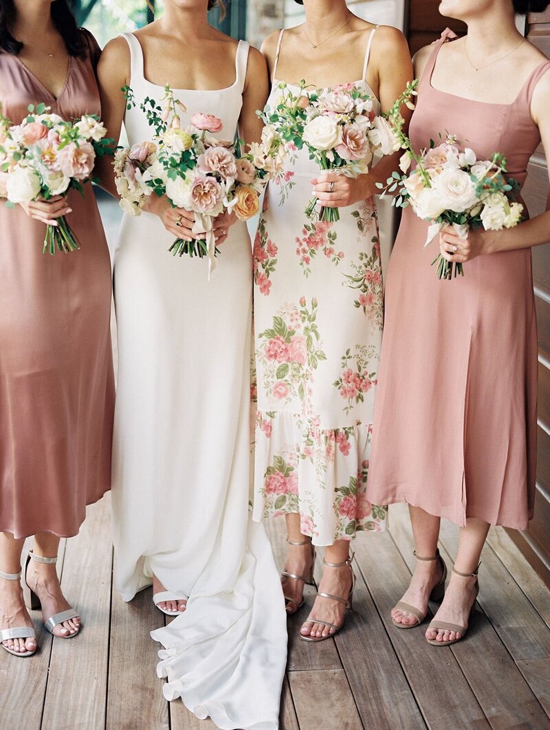 Mix match bridesmaid dresses, floral print, white, tan, blush and peach bouquets
