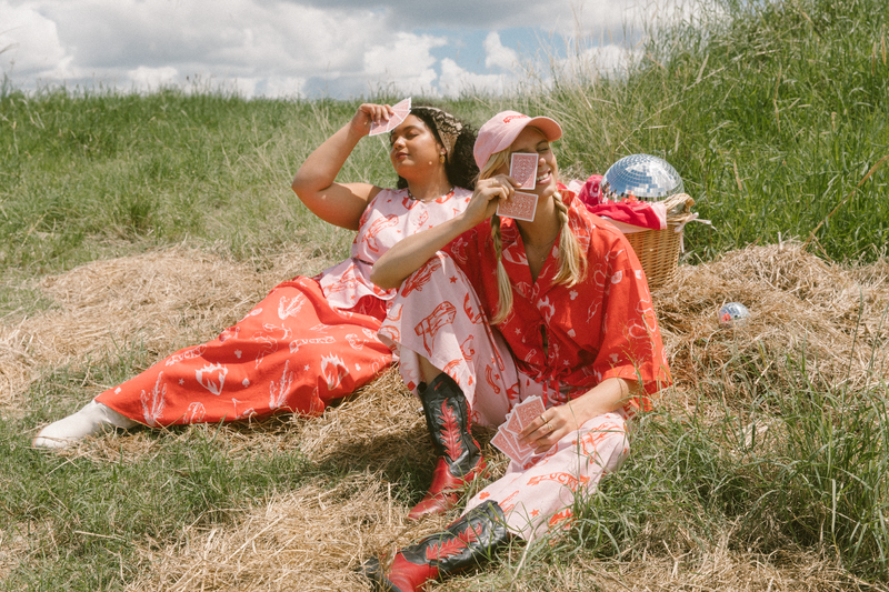 Pink and red campaign fashion photoshoot on farm