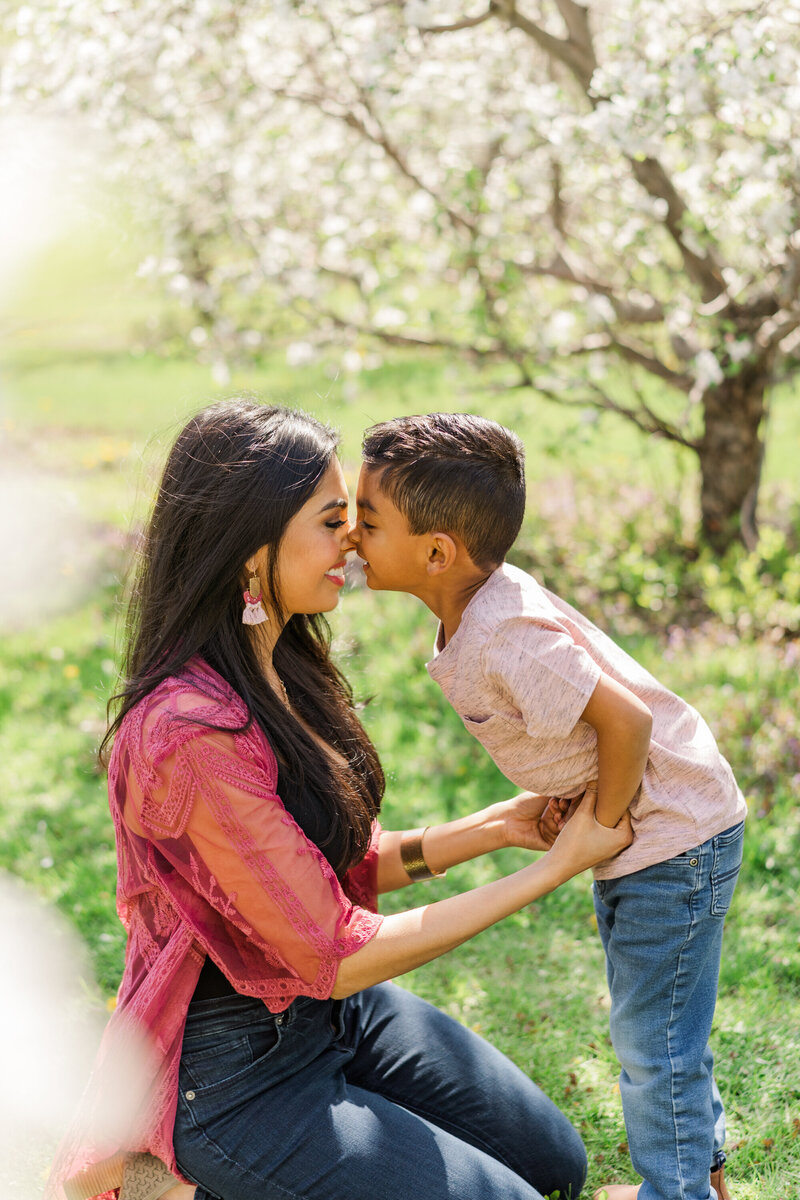 mother and son rub noses during outdoor motherhood session