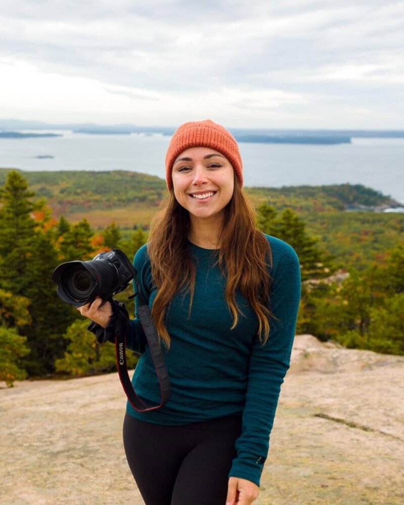 content creator jkrow wearing a blue long sleeve shirt standing on a hiking trail