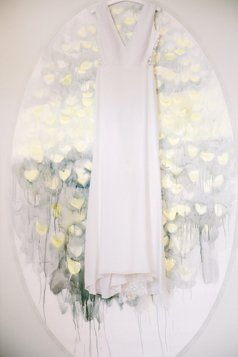 wedding dress hanging in getting ready space at ladybird johnson wildflower center by austin wedding photographer