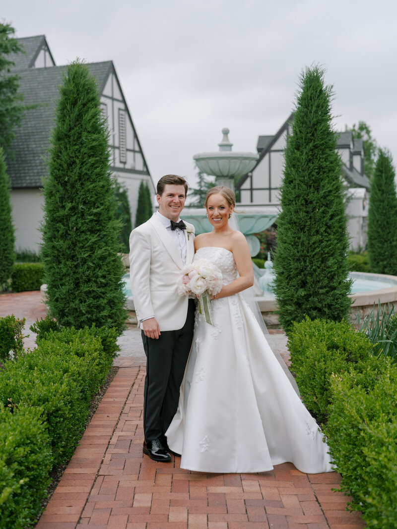 A bride and groom facing each other at Oklahoma Golf and Country Club