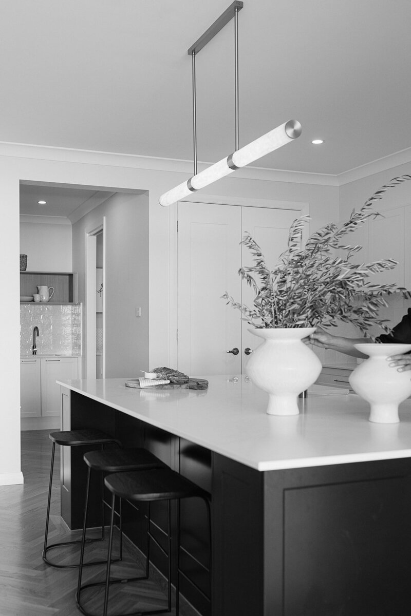 Black white kitchen with white vase