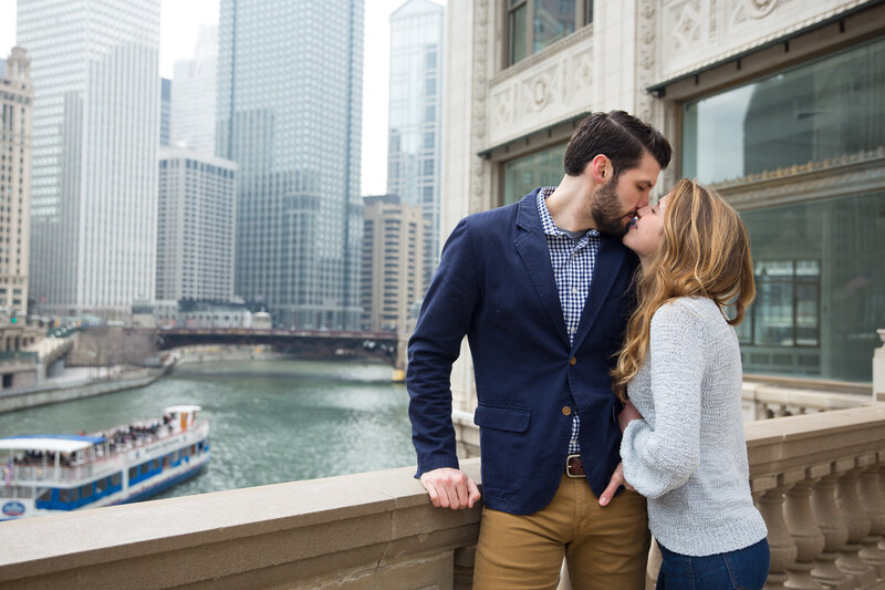 couple on michigan avenue hugging  after surprise proposal in downtown chicago