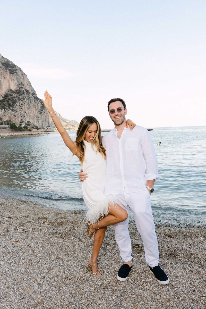 A couple of guests having fun next to the Mediterranean sea.