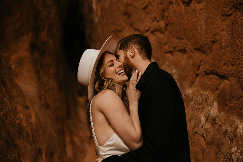 bride and groom embracing and smiling