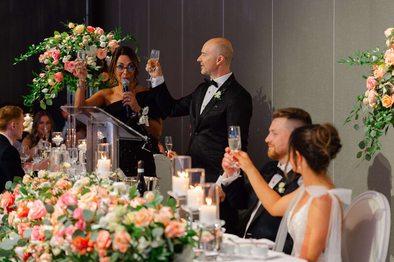 Ottawa wedding photography showing the mother and father of the bride toasting the couple during their Chateau Le Parc wedding