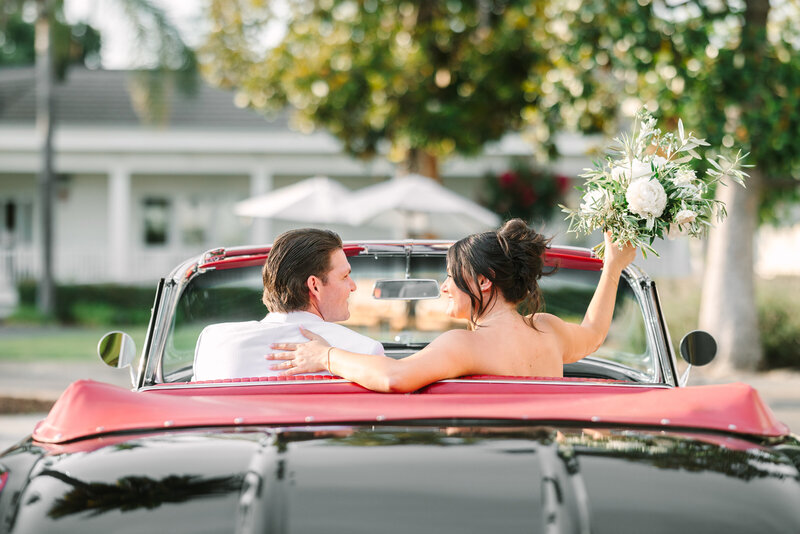 bride and groom sitting in classic car at silverado resort