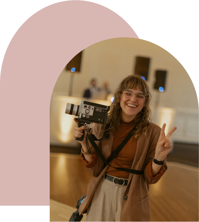 portrait of NYC Wedding and Destination Photographer holding Super 8 film camera