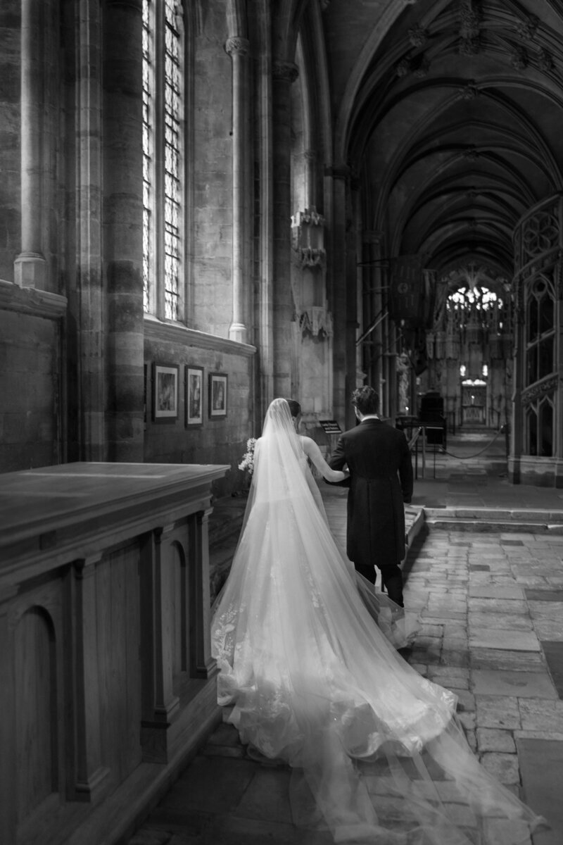 Couple portrait Ely cathedral from editorial wedding photographers, The Falkenburgs