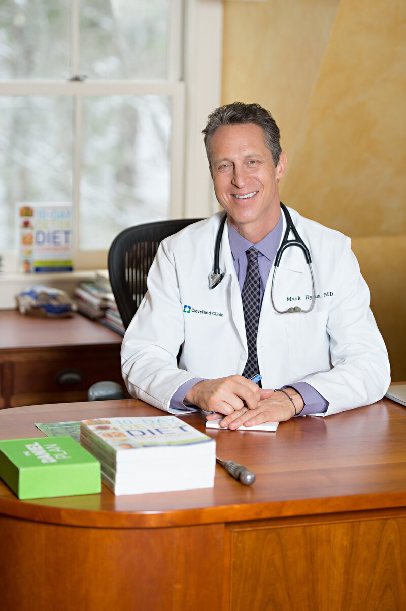 dr mark hyman sitting at desk