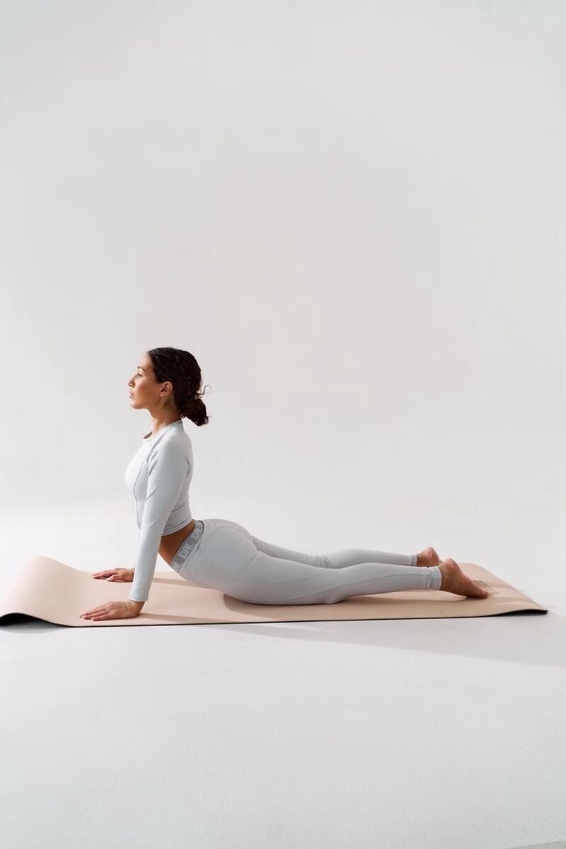 Image of personal fitness trainer sitting on road