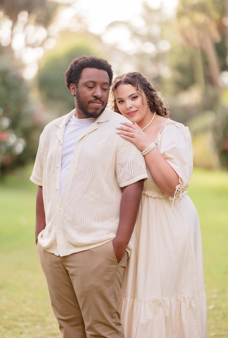 Couple posing in a park during their engagement session in North Florida.