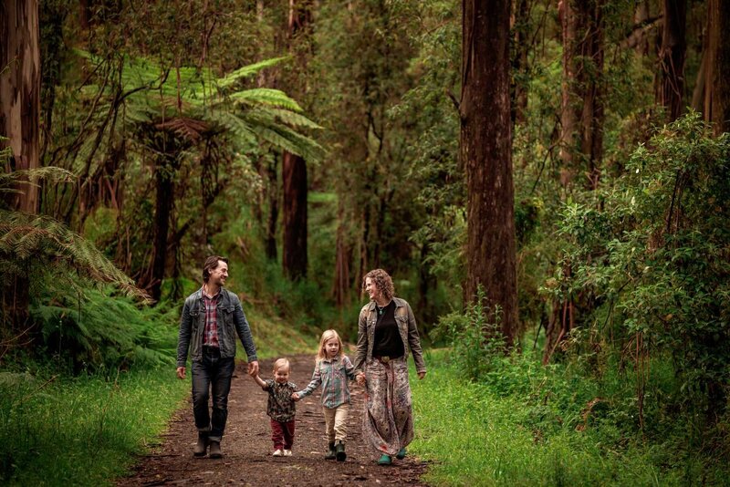 Family walking along the forest track at Kallista