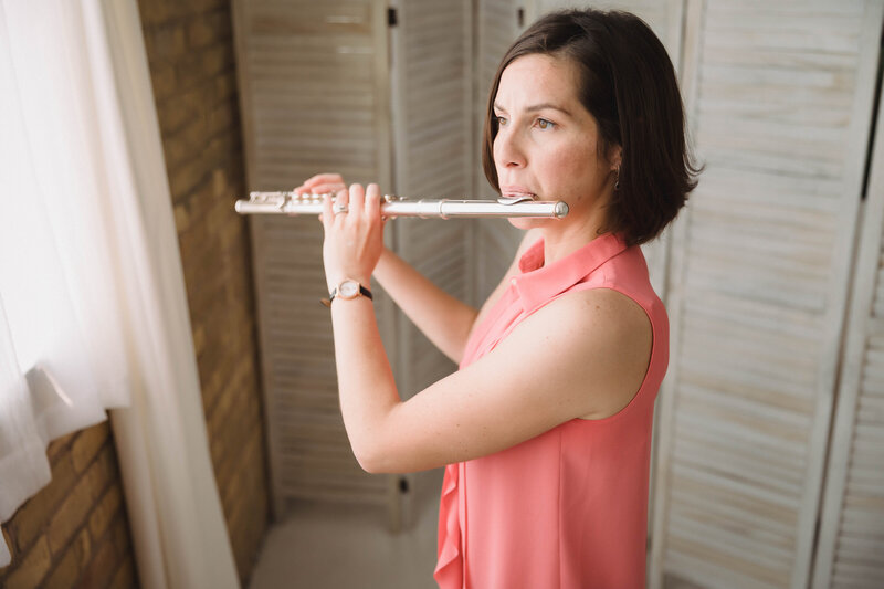 Twin Cities Flutist & Teaching Artist Sarah Weisbrod Standing & Playing Flute