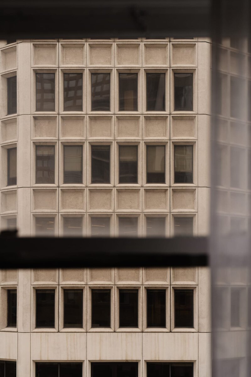 tan building with lots of windows from across street