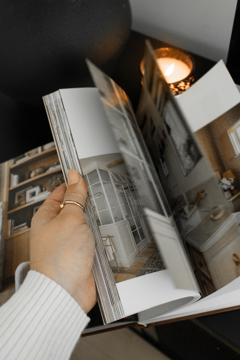 Flatlay of notebooks, mood boards, and design tools used in brand strategy sessions