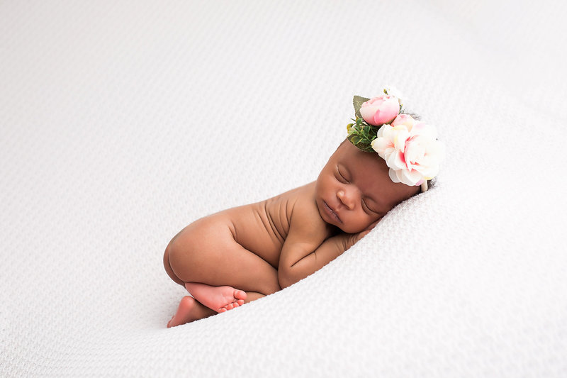 Newborn posed on blanket