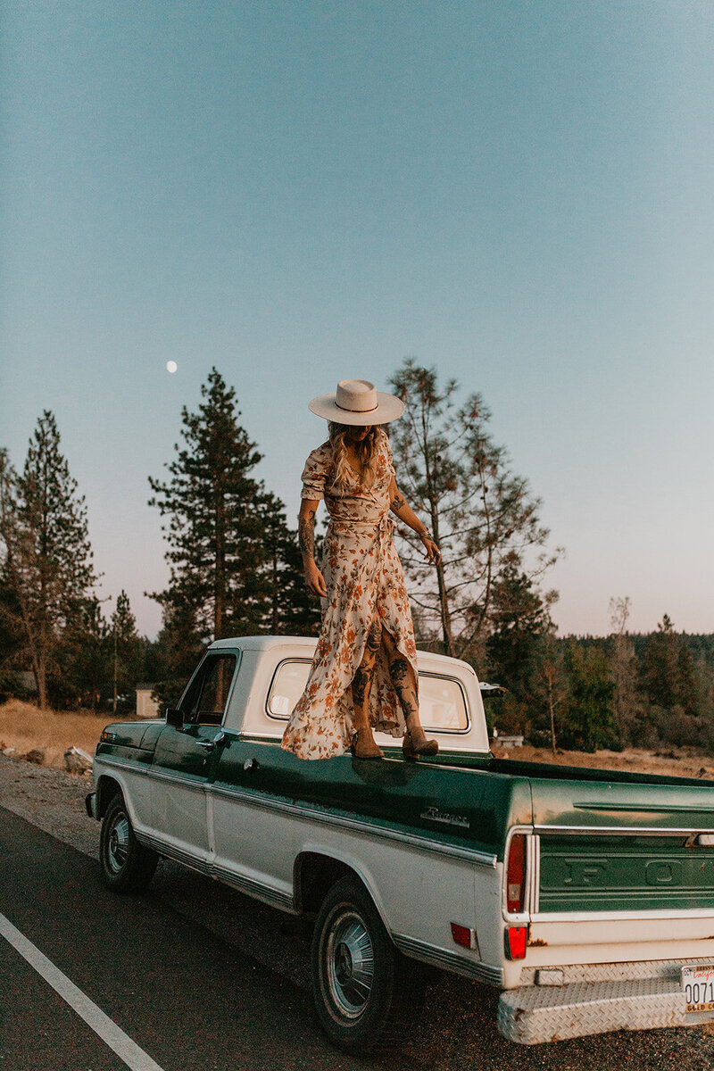 woman standing  on a truck