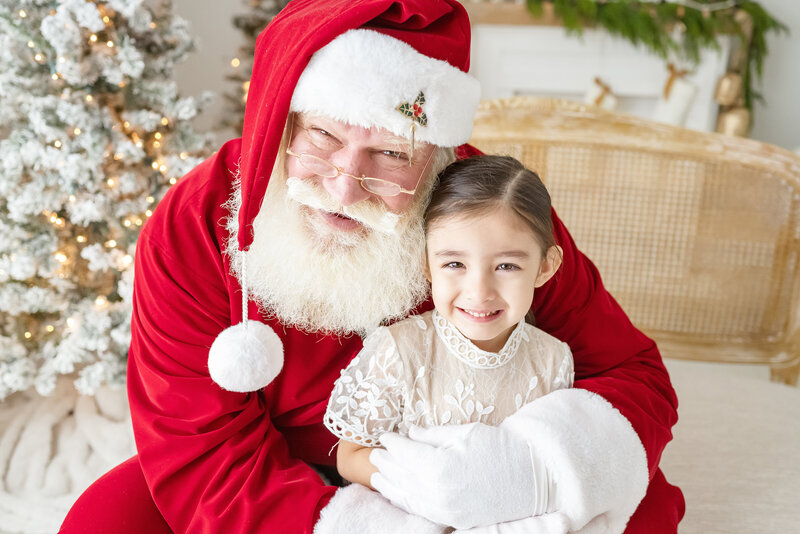 Simply Santa Sessions Chandler photographer Santa with child