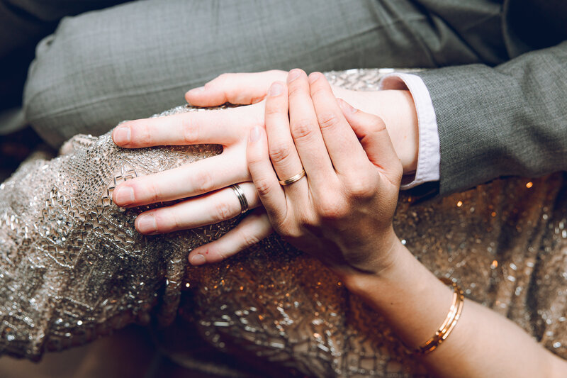 A couple hold hands at their wedding reception at Planta Queen in downtown Chicago