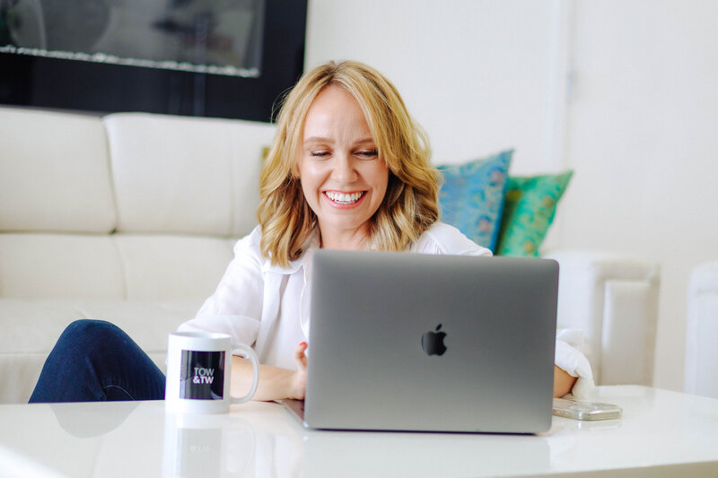 woman looking at computer smiling
