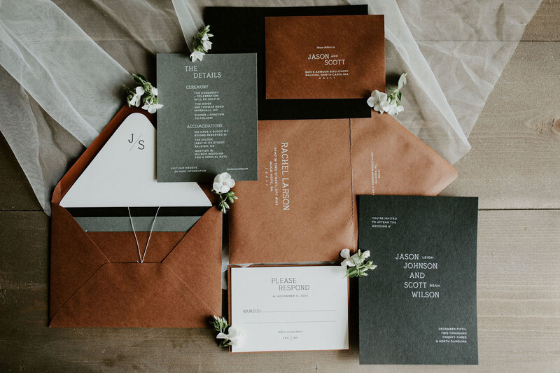 Wedding invitation suite with dark green invitations and brown envelopes