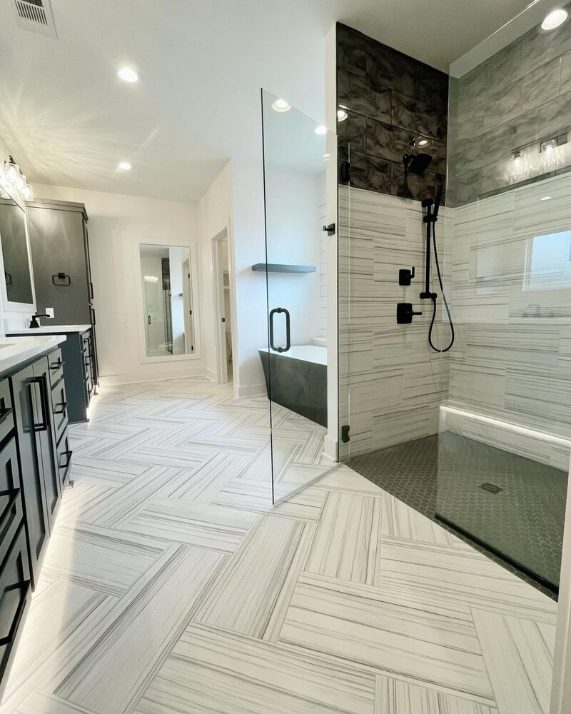 Custom shower with white and black tile.