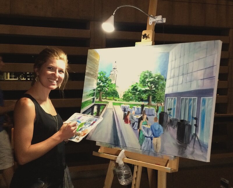 Stephanie Gaffney, owner of Torregrossa Fine Art, showing off her very first live wedding painting