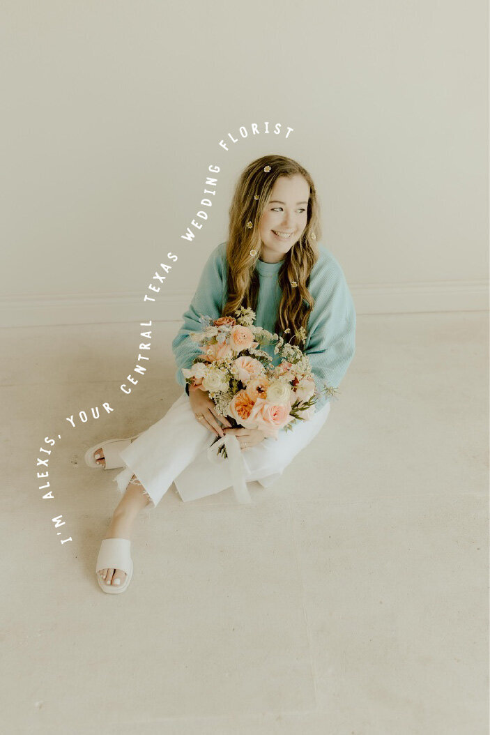 Central Texas wedding florist smiles as she holds local flowers.