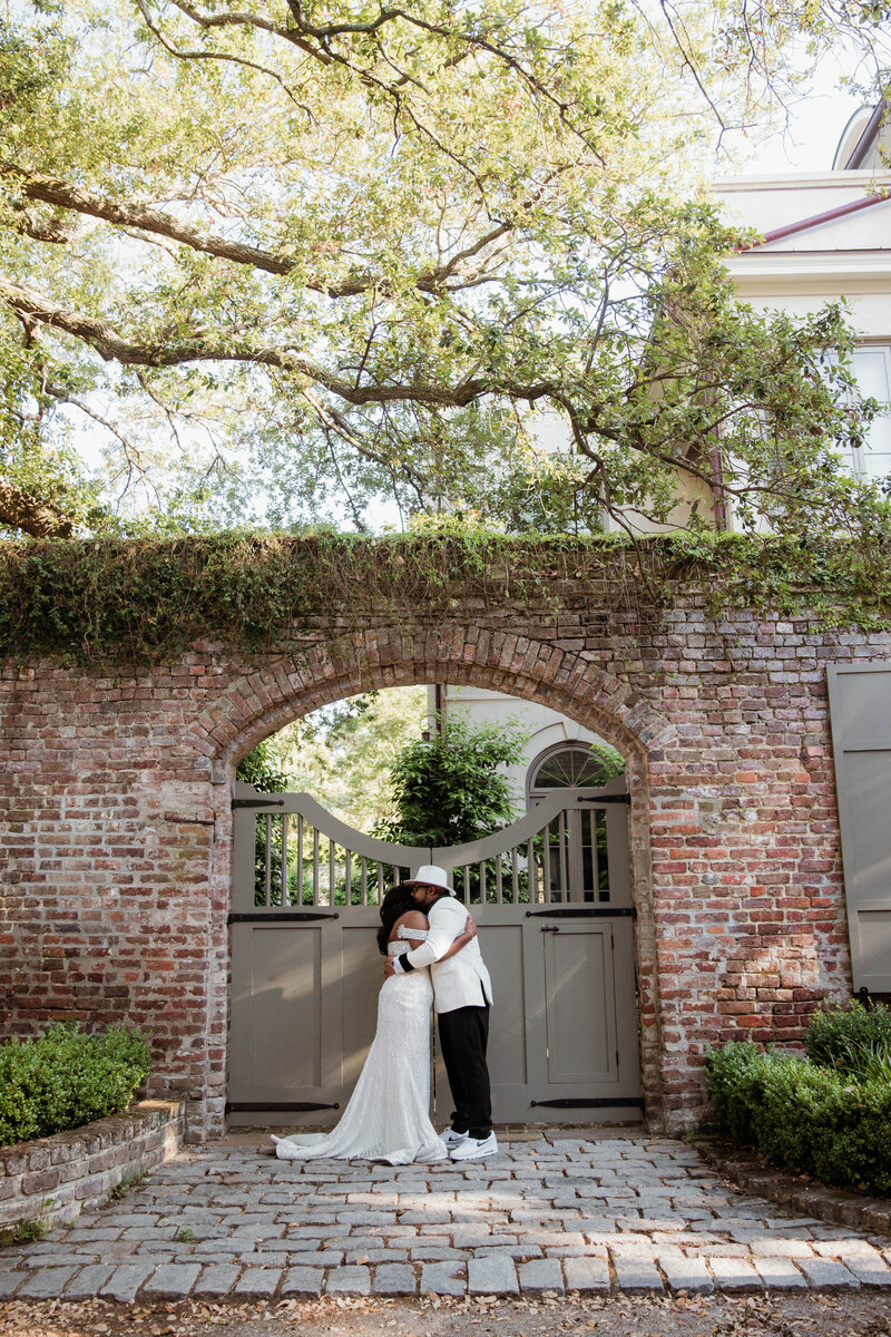 Newlyweds hugging after their Charleston White Point Garden elopement