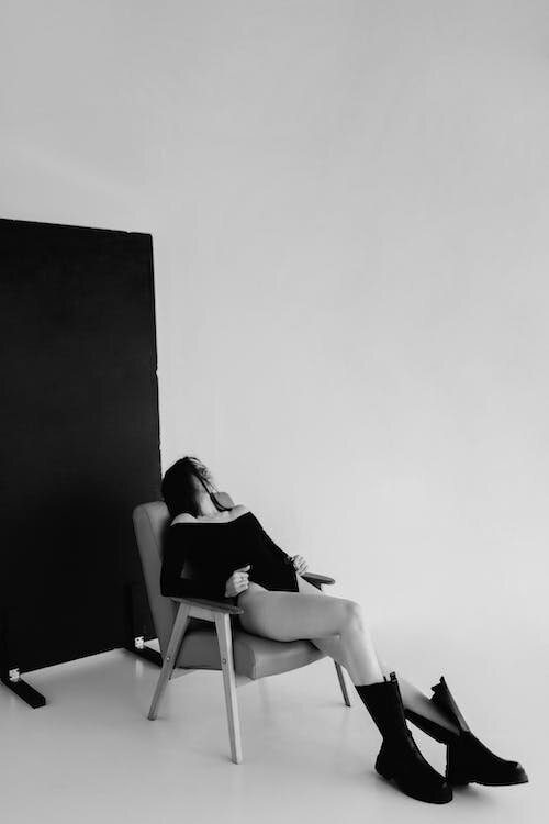 Brunette woman sitting in a stylish chair