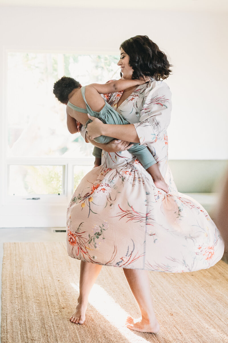 mom dancing with little boy