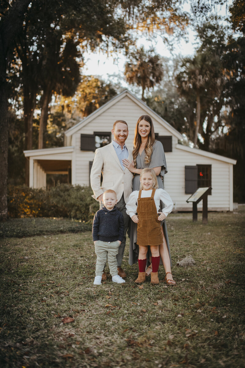 family with two adults and  two young kids for old town bluffton family session
