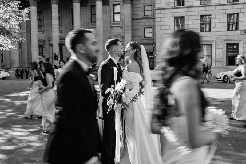 bride and groom cross Toronto street together