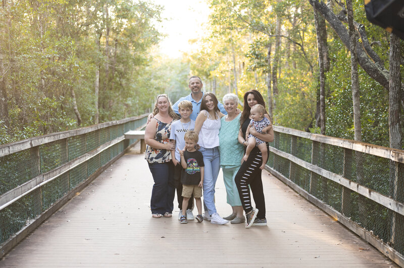 Family photo in Destin Florida hugging tightly
