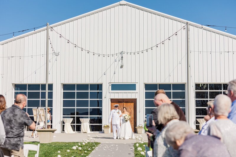guests at an outdoor wedding ceremony