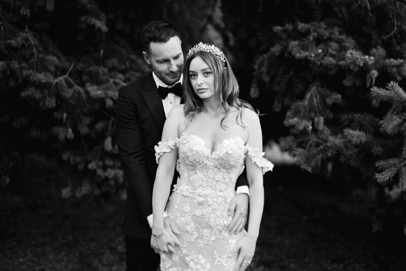 black and white portrait wedding photo of bride and groom looking to camera taken in manchester