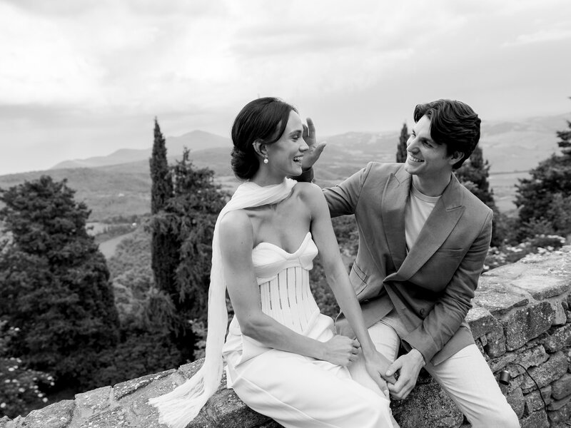 Bride in Monique Lhuillier walks with her father down the aisle at her wedding in Ravello at Villa la Rondinaia