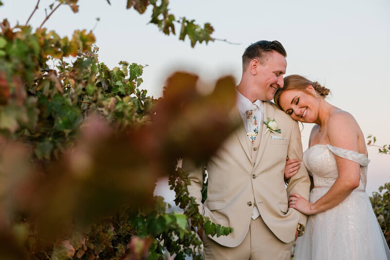 bride and groom having a moment during sunset