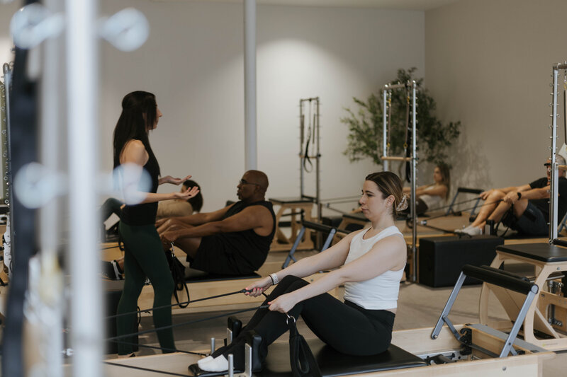 Katie teaching a group class Pilates 