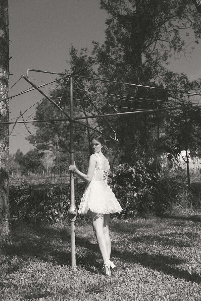 Black and white bridal portrait , inspired by expired film, bride standing in backyard Sunshine Coast