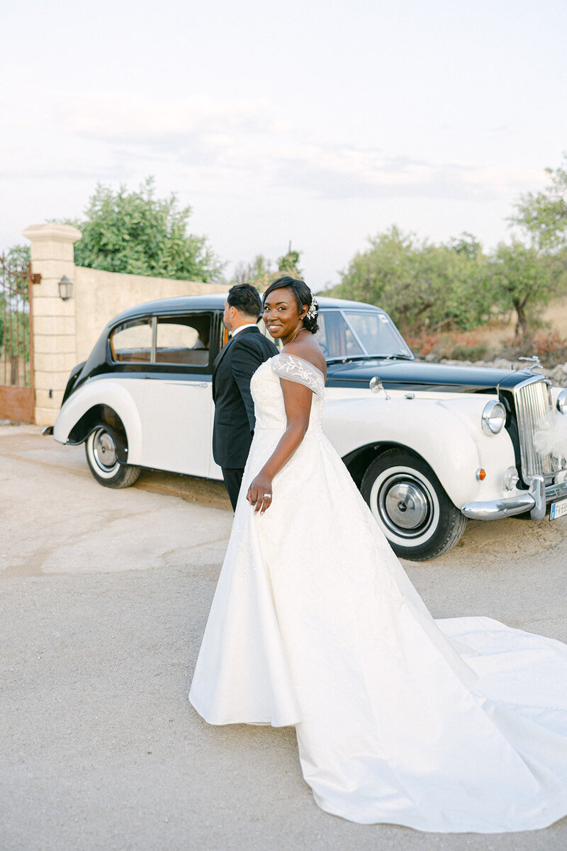 a bride and groom about to get into a vintage car