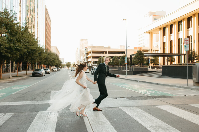 A couple shares a romantic moment under an ancient stone archway