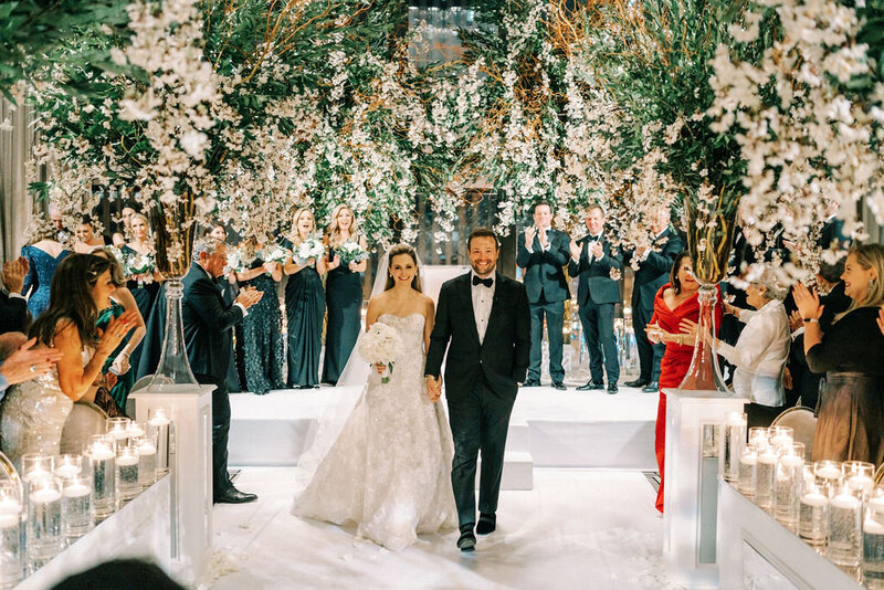 Bride and groom holding hands at the Langham Chicago venue