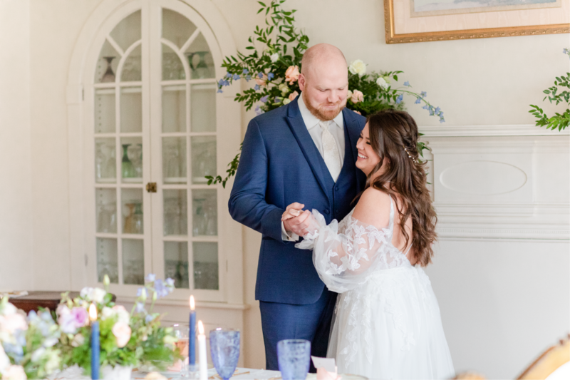 bride and groom holding hands smiling