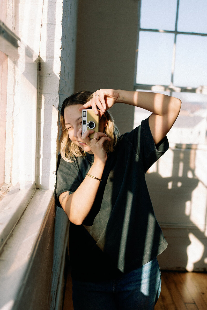 Photographer posing with camera