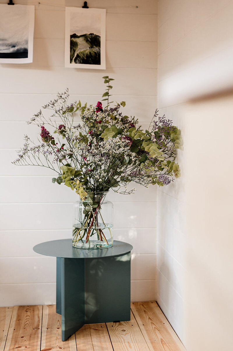 Vase of natural bouquet of flowers on Hay Design side table in Hygge and Cwtch studio